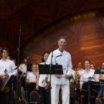 Members of Longwood Symphony Orchestra perform onstage at the Hatch Shell.