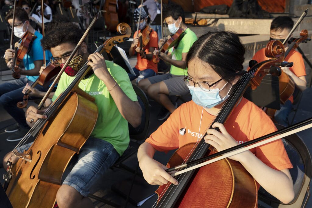 Students from Boston String Academy play their string instruments.