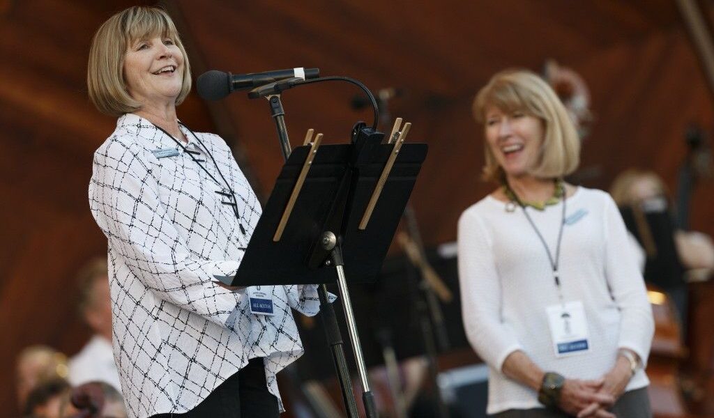 Laura Connors is standing onstage on the Hatch Shell.