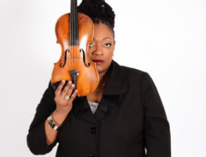 Headshot of Mariana Green-Hill; she is holding a violin next to her face.