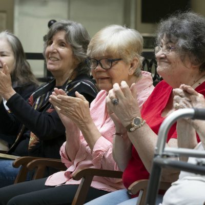 Audience at a Music & Memory concert applaud.