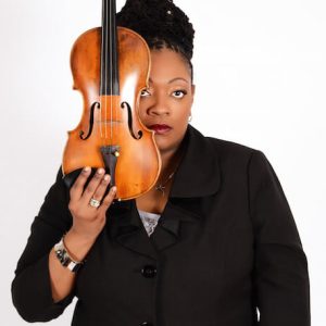 Headshot of Mariana Green-Hill. She's holding a violin up to her face.